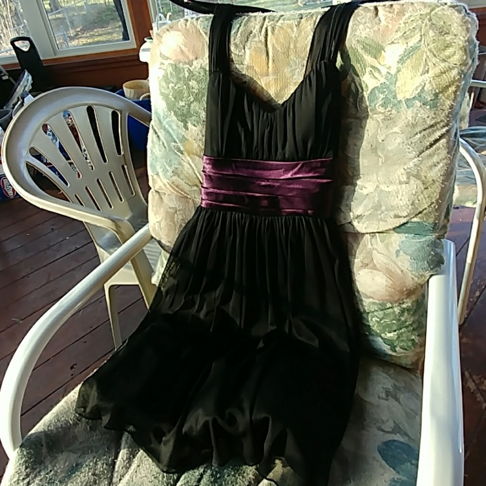 Black dress with purple tie waist.